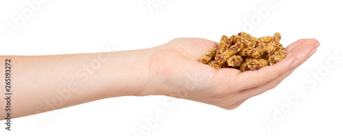 Hand with home made granola, healthy food, sweet snack.