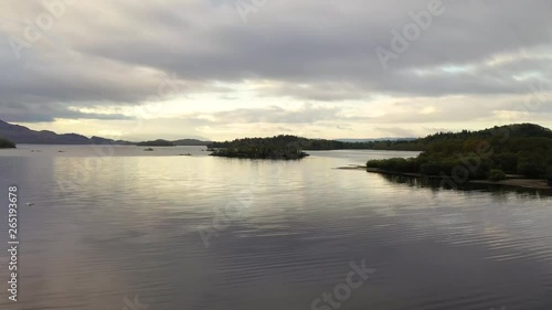Aerial depiction of beautiful Loch Lomond at sunrise, featuring Fraoch Eilean and Eilean Daraich islets, Scottish Highlands, Scotland