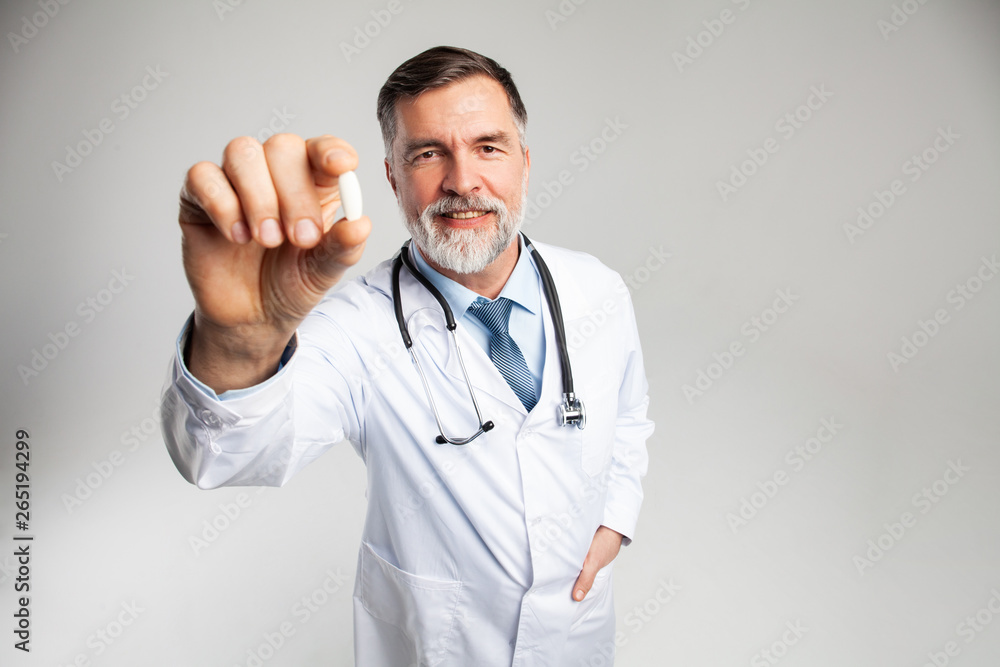 healthcare and medical concept - doctor with pill in hospital healthcare and medical concept - doctor with pill in hospital