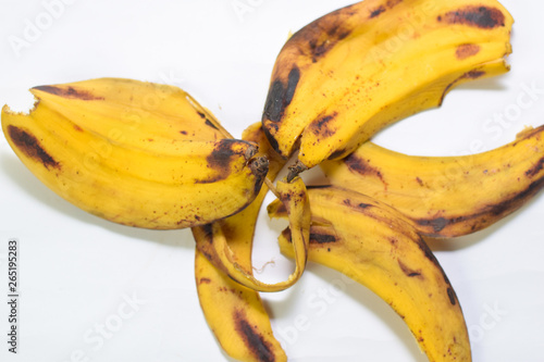 Close up yellow banana peel isolated on white background
