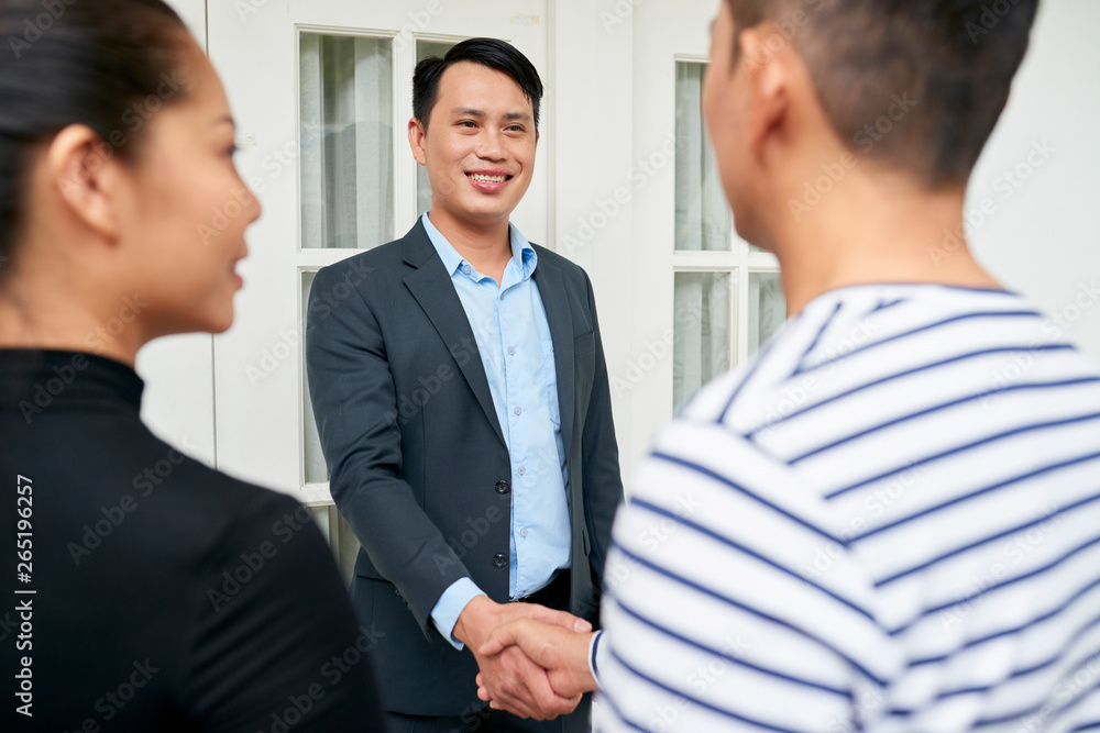 Businessman concluding a deal with customers Businessman concluding a deal with customers
