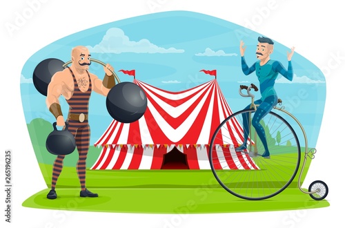 Circus equilibrist on unicycle and muscleman show