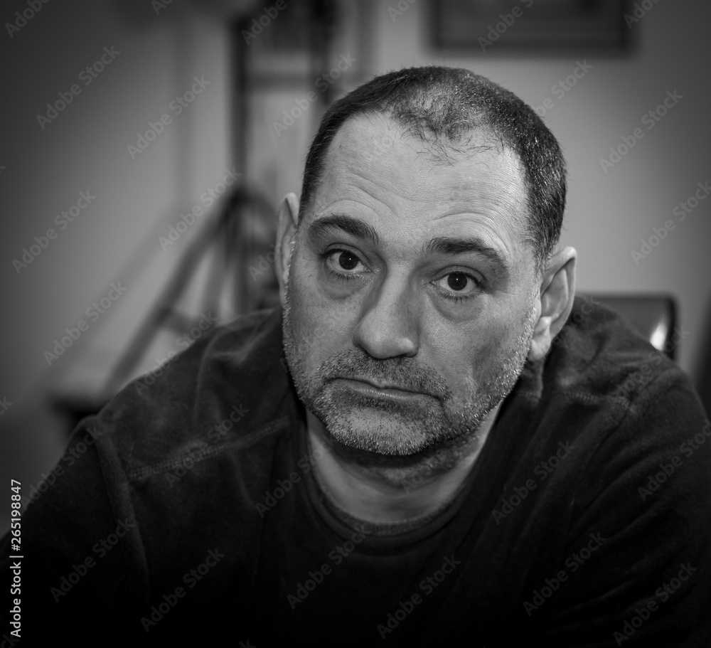 Portrait of middle age man, with unshaved face, black and white colors. Portrait of middle age man, with unshaved face, black and white colors.