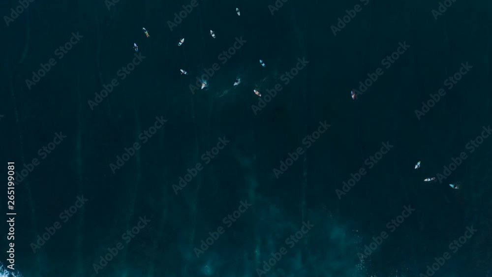 Top aerial timelapse of famous Uluwatu cliff in Bali, Indonesia, and surfers on big blue ocean waves Top aerial timelapse of famous Uluwatu cliff in Bali, Indonesia, and surfers on big blue ocean waves