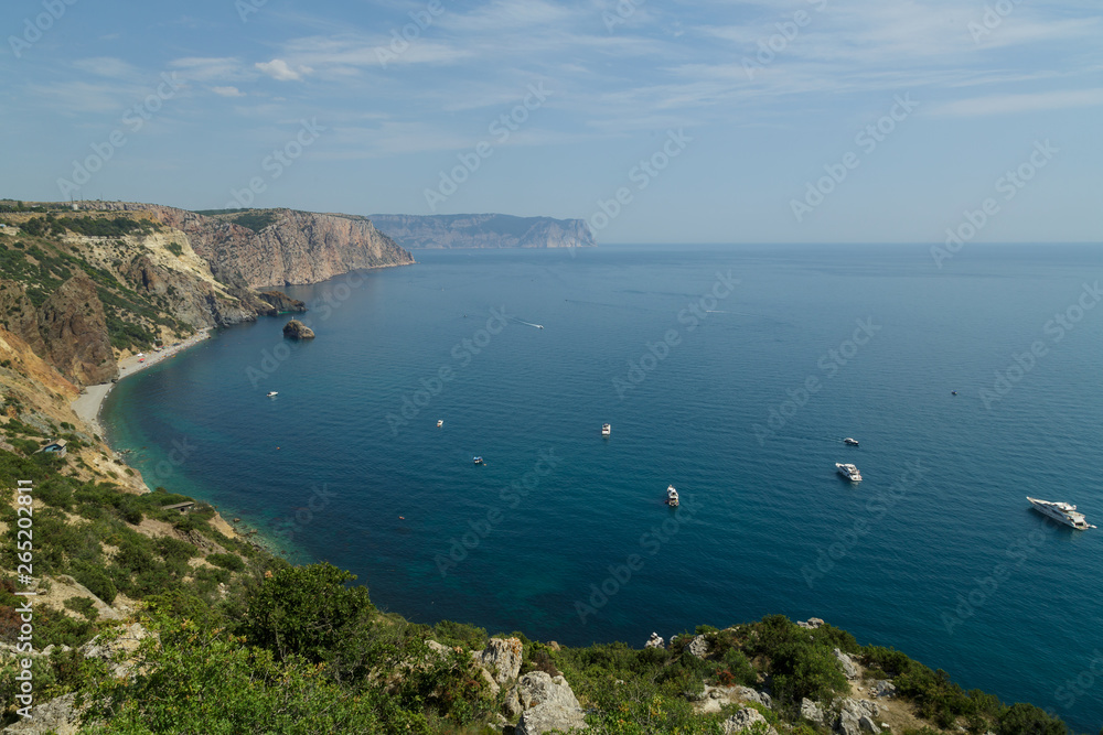 View from the cliffs on the sea, in which yachts float.