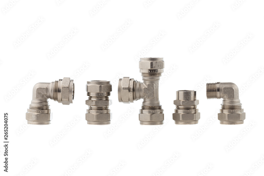 Fittings for water on a white background. Brass fittings close-up. Fittings for water on a white background. Brass fittings close-up.