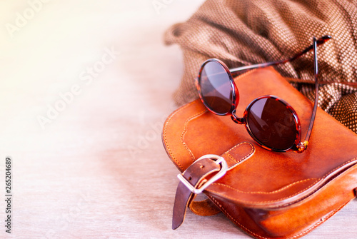 Summer style. Fashion summer girl clothes set, accessories. Trendy sunglasses, slippers, handbag clutch, watch, jeans, scarf. Summer lady. Creative urban overhead summer top view