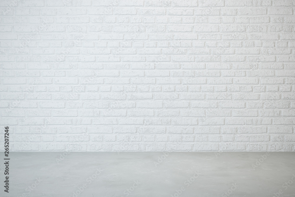 empty room with brick wall and concrete floor empty room with brick wall and concrete floor