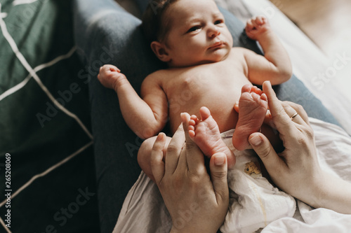 the child lies on his mother's lap