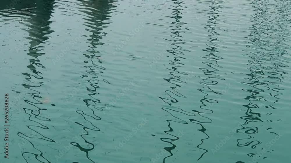 Blue water ripples with reflection. Sea or lake surface. Abstract wavy background Blue water ripples with reflection. Sea or lake surface. Abstract wavy background
