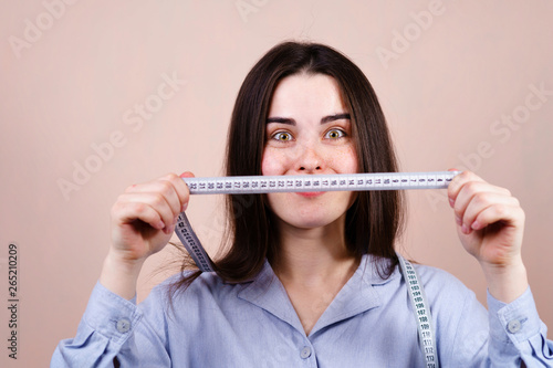 happy excited woman holding measuring tape. measurement, weight loss, diet and healthy lifestyle