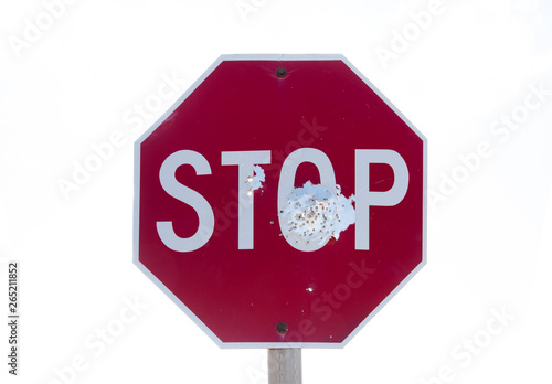 Φωτογραφία Red road stop sign full of bullet holes