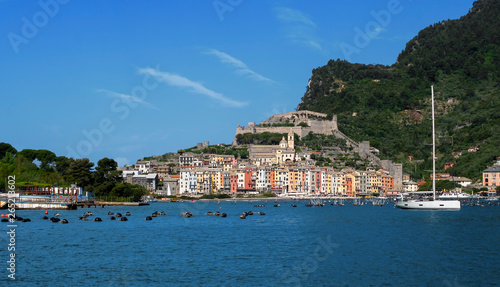 Portovenere town harbour, seafront, church and castle, visited and appreciated by tourists from around the world. Liguria, Italy, the Gulf of Poets. © Mushy