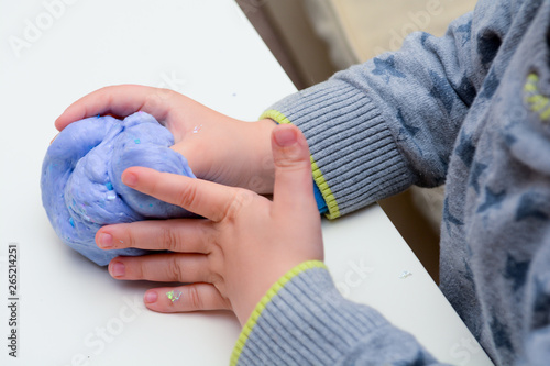 Playing with home made slime. Child plays with slime made from recipe