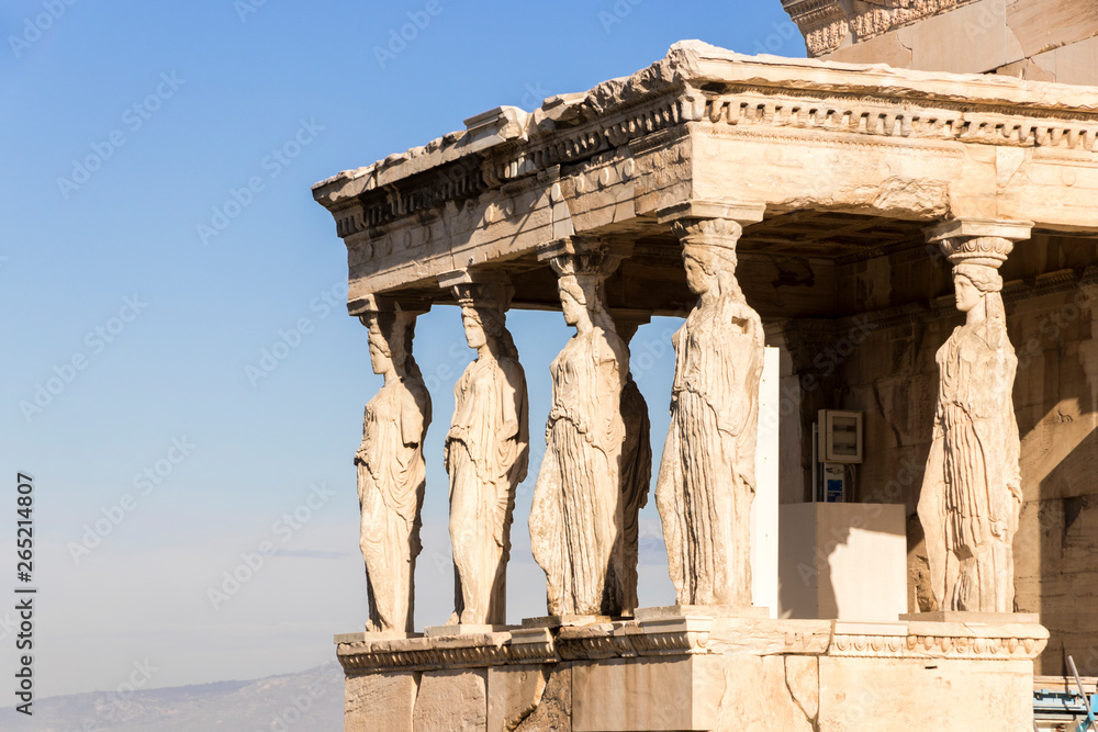 Obraz premium Athens, Greece. The Porch of the Caryatids at the Erechtheion, an ancient Greek temple on north side of the Acropolis dedicated to Athena and Poseidon