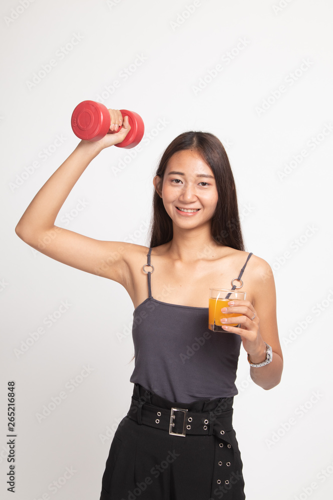 Young Asian woman with dumbbell drink orange juice. Young Asian woman with dumbbell drink orange juice.