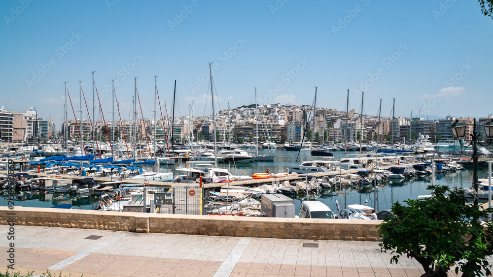 Small sailing boats and yachts docked at port of Piraeus, Greece Small sailing boats and yachts docked at port of Piraeus, Greece