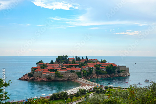 DRONE: Flying towards the historic town of Sveti Stefan in sunny Montenegro.