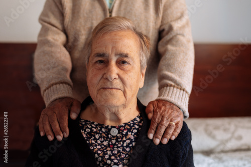 Senior couple sitting at home photo
