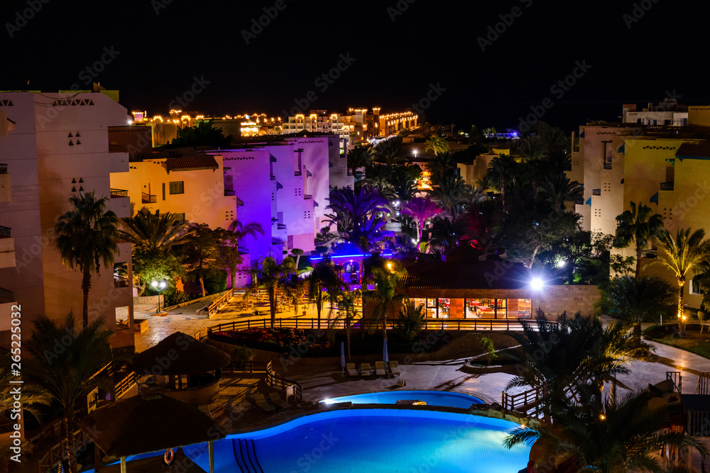 View on a swimming pool in hotel resort at night