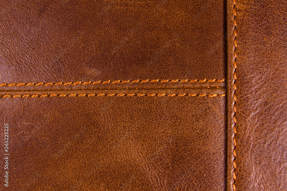 Texture of the natural brown leather and stitches Texture of the natural brown leather and stitches
