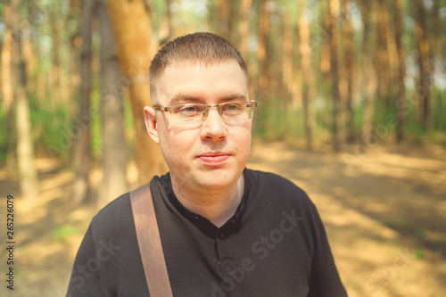 Portrait of a man outdoors. Male in the Park