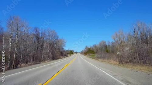 Wallpaper Mural Driving Rural Countryside During Spring Day.  Driver Point of View POV Along Beautiful Sunny Country Road. Torontodigital.ca