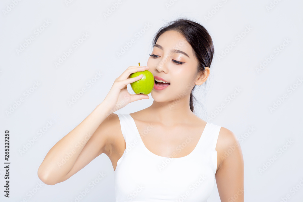 Portrait asian woman smiling eating green apple fruit and beautiful body diet with fit isolated on white background, girl weight slim with cellulite or calories, health and wellness concept. Portrait asian woman smiling eating green apple fruit and beautiful body diet with fit isolated on white background, girl weight slim with cellulite or calories, health and wellness concept.