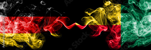 Germany vs Benin, Beninese smoky mystic flags placed side by side. Thick colored silky smoke flags of Deutschland and Benin, Beninese