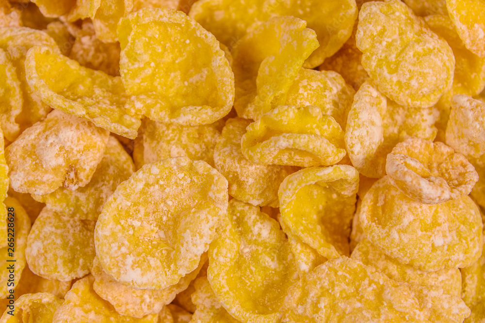 Background of the many yellow cornflakes. Healthy eating Background of the many yellow cornflakes. Healthy eating