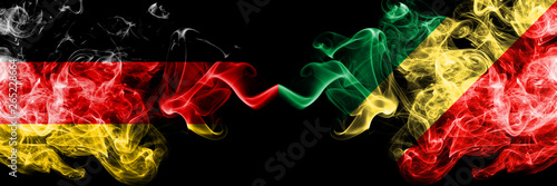 Germany vs Congo, Congolese smoky mystic flags placed side by side. Thick colored silky smoke flags of Deutschland and Congo, Congolese