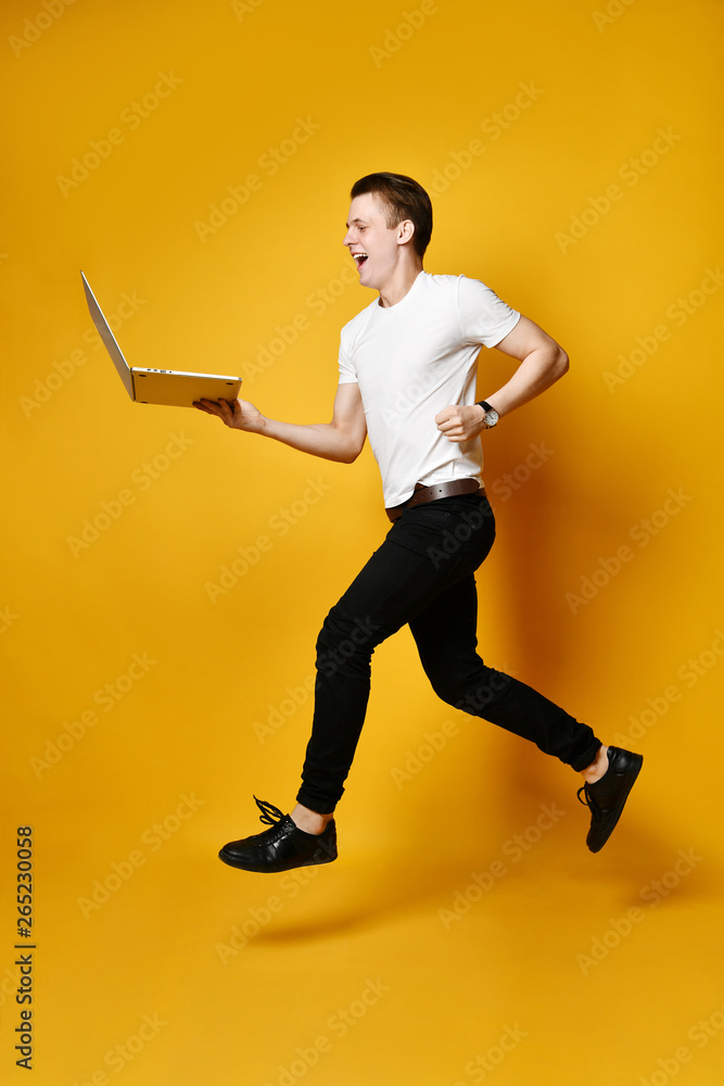 Jumping student with laptop Jumping student with laptop