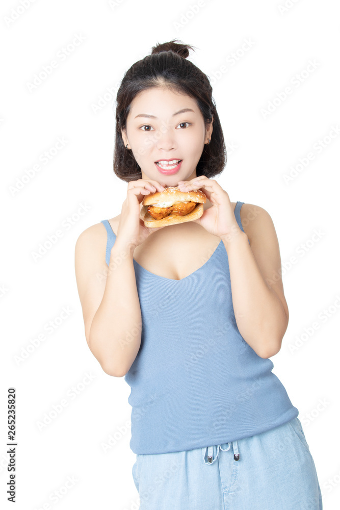 Chinese American woman eating Chicken Sandwich isolated on white background Chinese American woman eating Chicken Sandwich isolated on white background