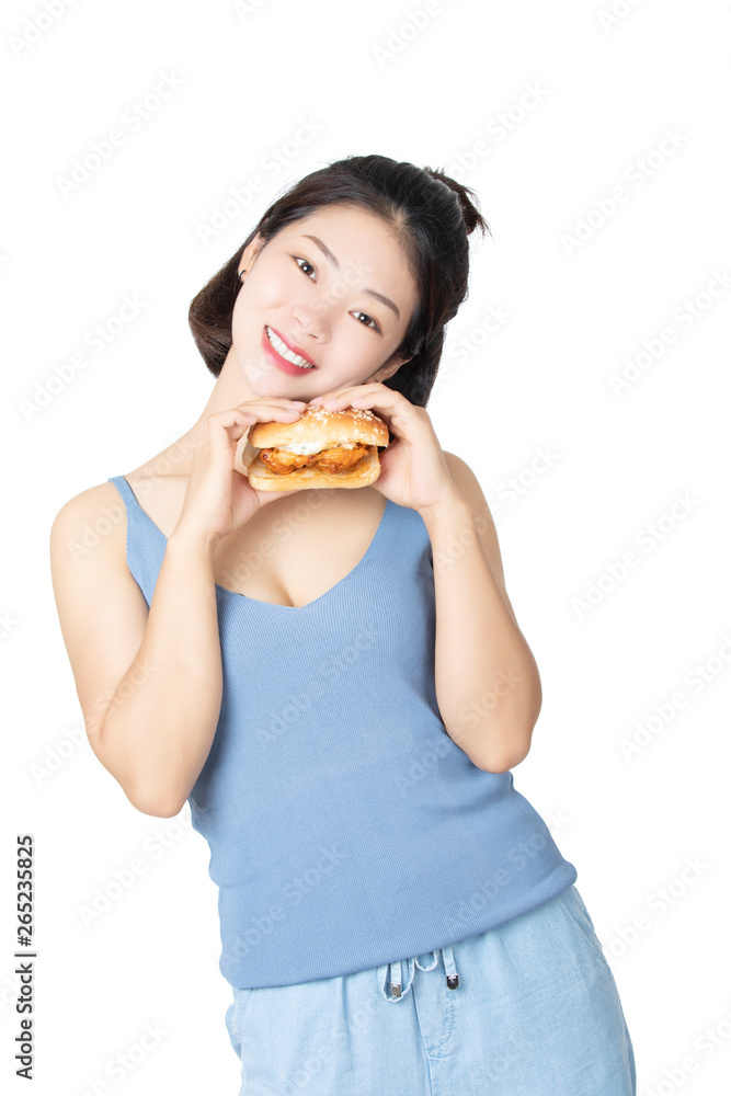 Chinese American woman eating Chicken Sandwich isolated on white background Chinese American woman eating Chicken Sandwich isolated on white background