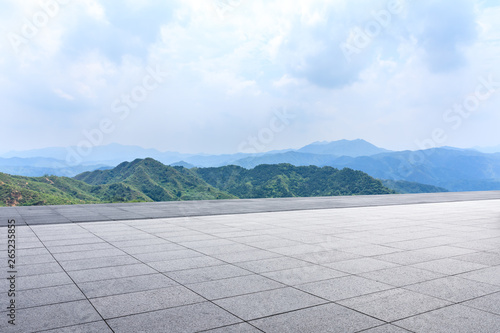 Empty square floor and green mountain natural landscape © ABCDstock