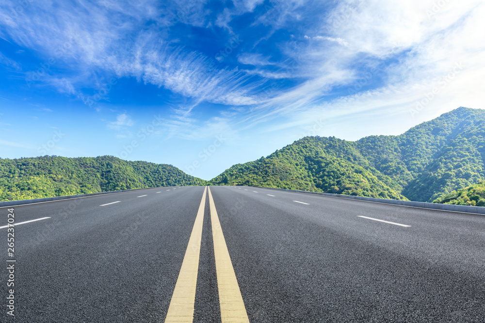 Straight highway and beautiful mountain natural landscape Straight highway and beautiful mountain natural landscape