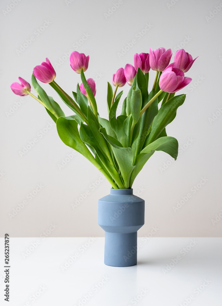 Pink spring tulip flowers in ceramic vase Pink spring tulip flowers in ceramic vase
