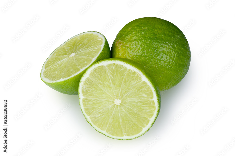 Whole and half with slice of fresh green lime isolated on white background with clipping path Whole and half with slice of fresh green lime isolated on white background with clipping path