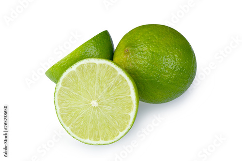 Fototapeta Naklejka Na Ścianę i Meble -  Whole and half with slice of fresh green lime isolated on white background with clipping path