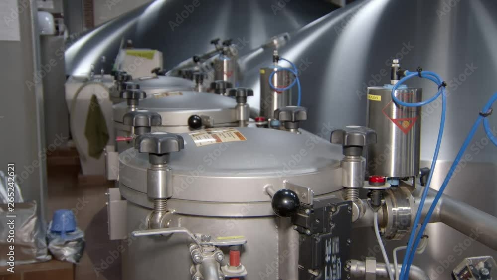 few tanks with hop in workshop of beer factory, automatic process of pouring hop few tanks with hop in workshop of beer factory, automatic process of pouring hop