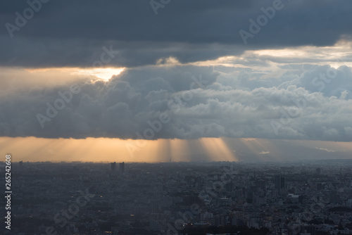 Aerial of Tokyo suburb cityscape with picturesque clouds and sunrays at sunset photo