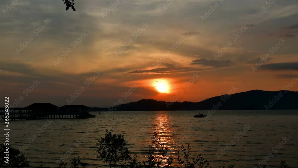 Sunset at the seaside, time lapse motion.