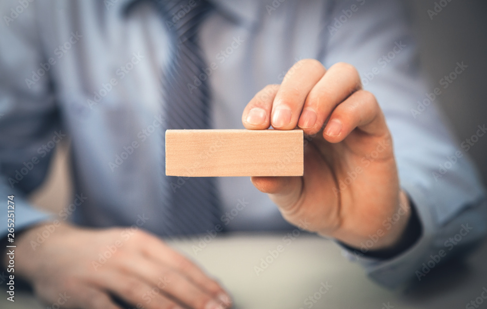 Man holding blank wooden block. Business concept Man holding blank wooden block. Business concept