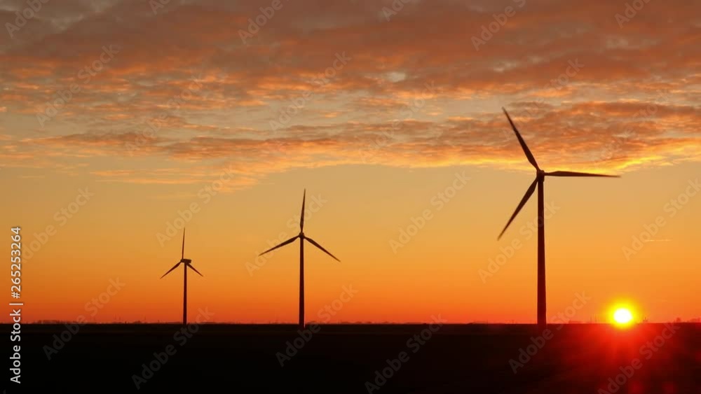 Timilapse of Wind Turbines Generating Green Energy at Sunset in The Netherlands Timilapse of Wind Turbines Generating Green Energy at Sunset in The Netherlands