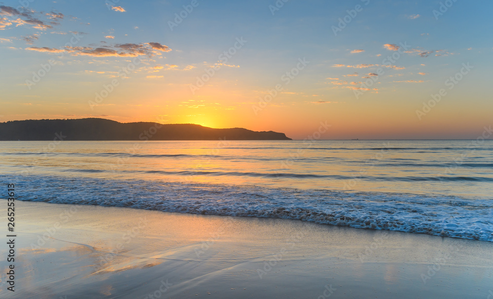 Sunrise Rising Over the Headland Seascape