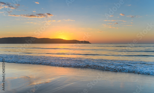 Sunrise Rising Over the Headland Seascape