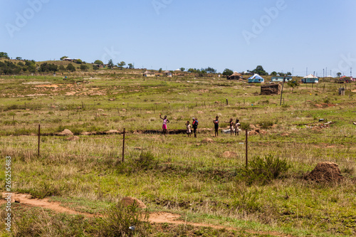 The rural huts and dwellings alongside the train tracks and the Ngwangwane river, Creighton, South Africa. photo