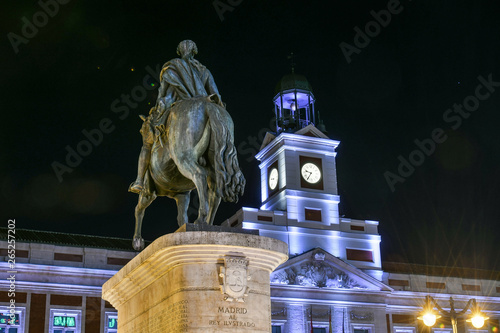 Monument to Carlos III in the Plaza Mayor of Madrid at nightfall photo