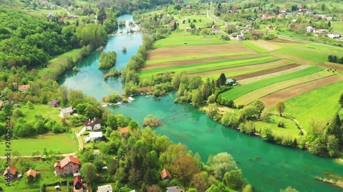 Croatia, countryside landscape, beautiful green Mreznica river from drone, panoramic view of Belavici village and waterfalls in spring, popular tourist destination photo