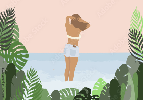 Girl in a swimsuit and jeans on the sea background in green palm leaves frame